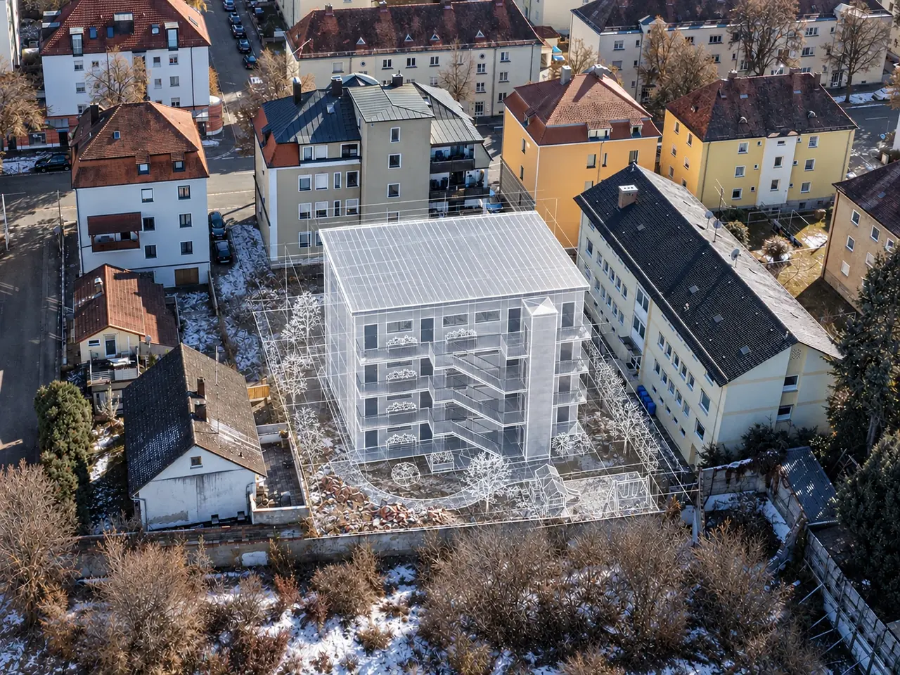 Luftbild mit Projektvisualisierung: der geplante Neubau als weißes Gebäudemodell auf dem Grundstück